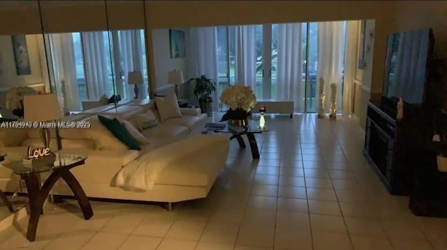 living room with tile patterned floors