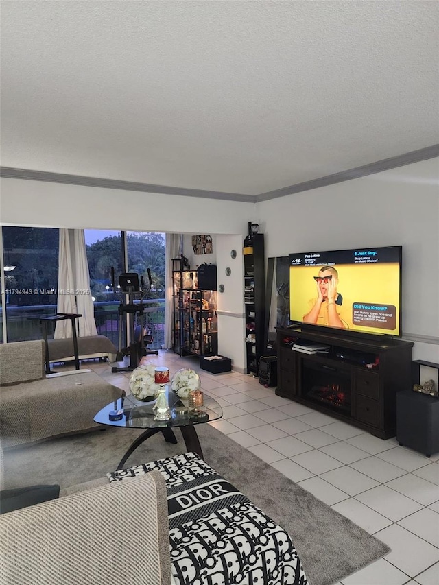 living area featuring ornamental molding and light tile patterned floors