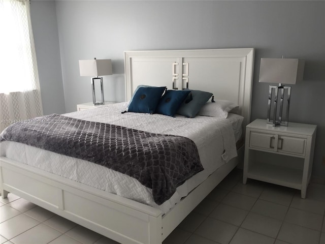 bedroom featuring tile patterned flooring