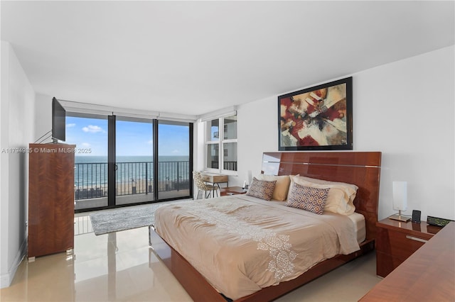 tiled bedroom featuring access to exterior and expansive windows