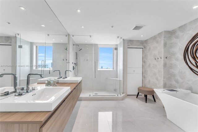17111 Biscayne Blvd Unit 2208, Aventura, FL 33160 - full bathroom featuring a stall shower, a freestanding bath, double vanity, and recessed lighting