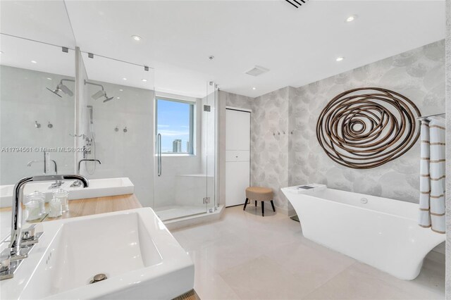 17111 Biscayne Blvd Unit 2208, Aventura, FL 33160 - bathroom featuring a shower stall, a freestanding bath, recessed lighting, and vanity
