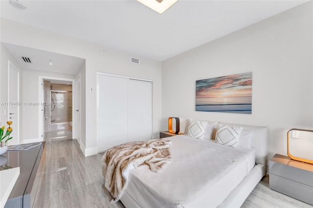 17111 Biscayne Blvd Unit 2208, Aventura, FL 33160 - bedroom featuring baseboards, visible vents, wood finished floors, and a closet