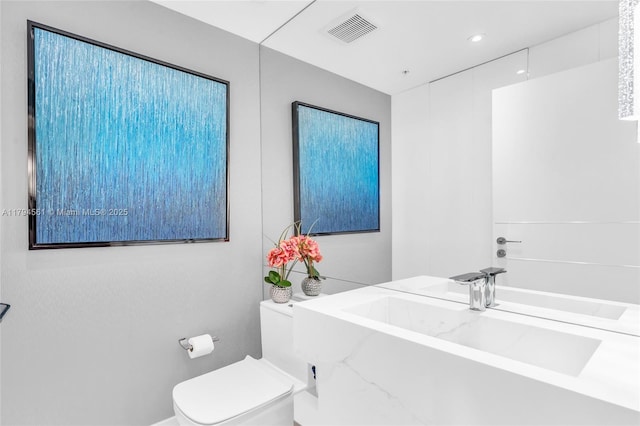 17111 Biscayne Blvd Unit 2208, Aventura, FL 33160 - bathroom featuring a sink, toilet, a tub to relax in, and visible vents