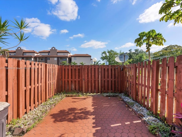 8000 SW 152nd Ave Unit 111, Miami, FL 33193 - view of patio featuring a residential view and a fenced backyard