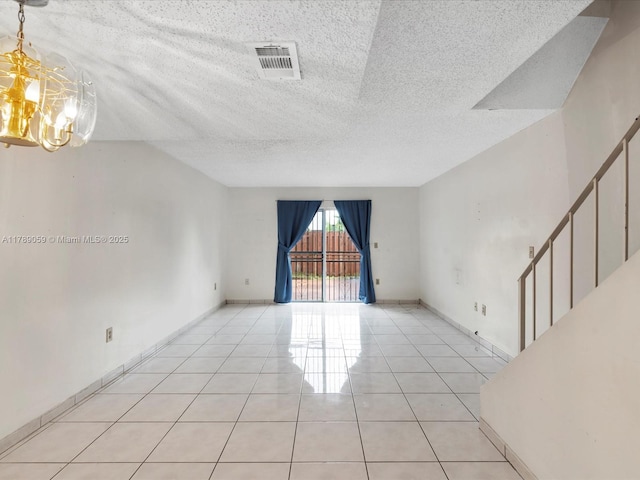 8000 SW 152nd Ave Unit 111, Miami, FL 33193 - unfurnished room featuring a textured ceiling, a chandelier, stairs, light tile patterned floors, and visible vents
