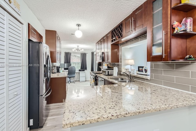 4220 NW 114th Ave, Sunrise, FL 33323 - kitchen with a sink, glass insert cabinets, tasteful backsplash, and stainless steel appliances