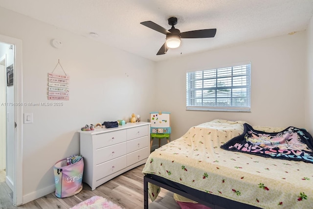 4220 NW 114th Ave, Sunrise, FL 33323 - bedroom featuring baseboards, a ceiling fan, and light wood-style flooring