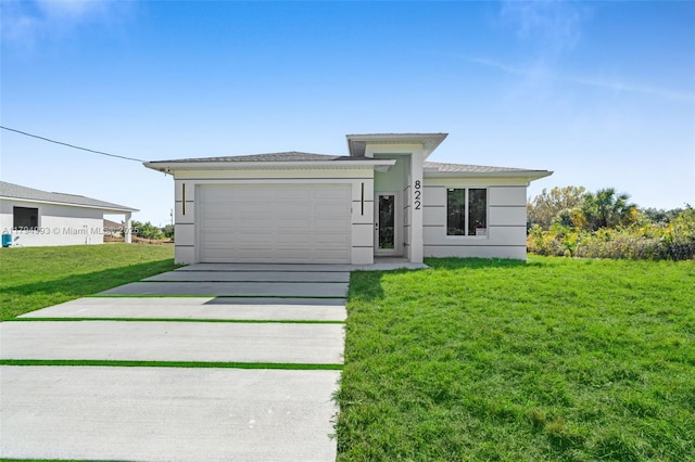 prairie-style home with concrete driveway, stucco siding, a front yard, and a garage