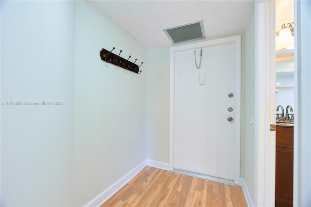 9150 Lime Bay Blvd Unit 201, Tamarac, FL 33321 - doorway featuring light wood-type flooring and baseboards