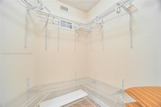 walk in closet featuring visible vents