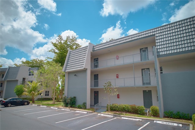 9150 Lime Bay Blvd Unit 201, Tamarac, FL 33321 - view of property with uncovered parking