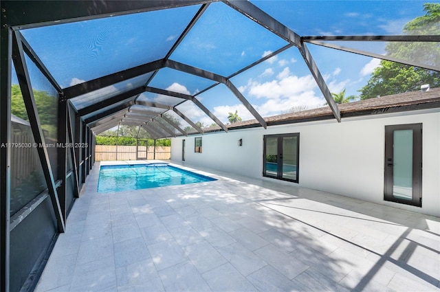 view of pool with a fenced in pool, a patio, and a lanai