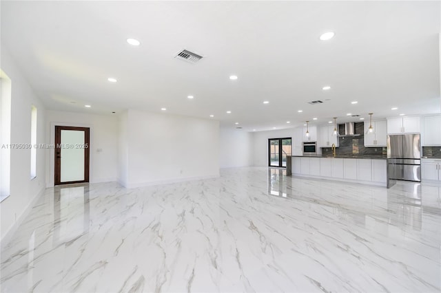 unfurnished living room featuring recessed lighting, baseboards, visible vents, and marble finish floor