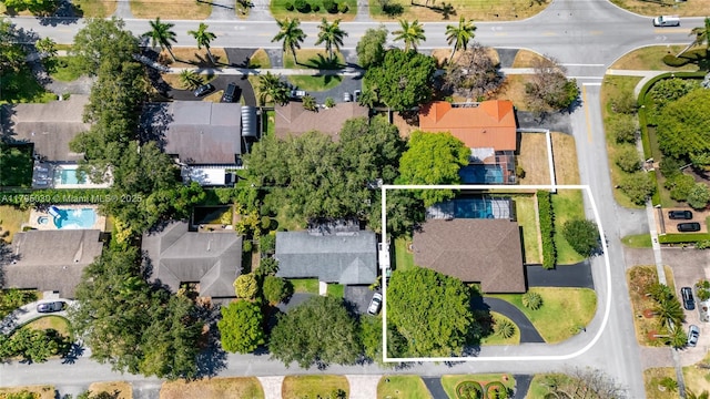 birds eye view of property with a residential view