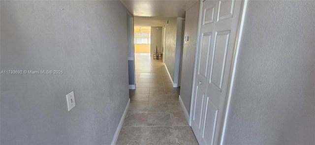 10207 Sunrise Lakes Blvd Unit 307, Sunrise, FL 33322 - hall featuring light tile patterned floors and a textured wall