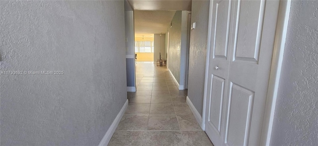 10207 Sunrise Lakes Blvd Unit 307, Sunrise, FL 33322 - hallway with light tile patterned floors and a textured wall
