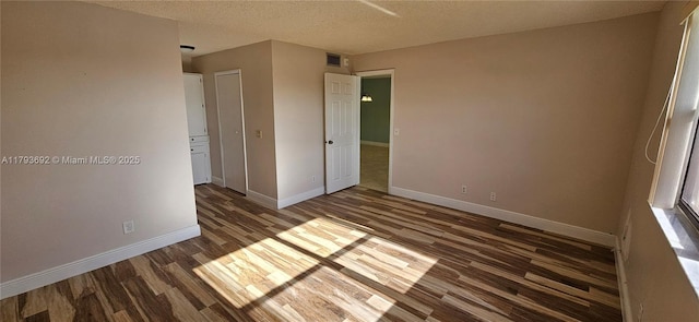 10207 Sunrise Lakes Blvd Unit 307, Sunrise, FL 33322 - spare room with wood finished floors and a textured ceiling