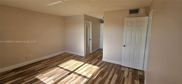 10207 Sunrise Lakes Blvd Unit 307, Sunrise, FL 33322 - unfurnished bedroom with wood finished floors and a textured ceiling