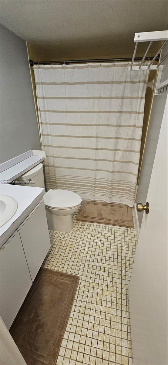 10207 Sunrise Lakes Blvd Unit 307, Sunrise, FL 33322 - full bath featuring vanity, a shower with shower curtain, and tile patterned floors