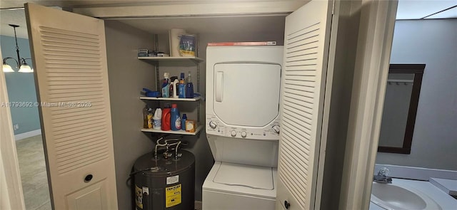10207 Sunrise Lakes Blvd Unit 307, Sunrise, FL 33322 - laundry room featuring stacked washer / drying machine and electric water heater