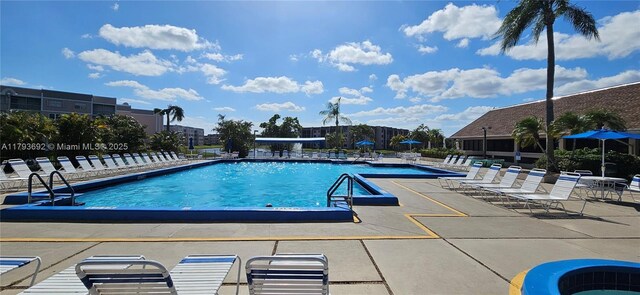 10207 Sunrise Lakes Blvd Unit 307, Sunrise, FL 33322 - community pool featuring a patio area