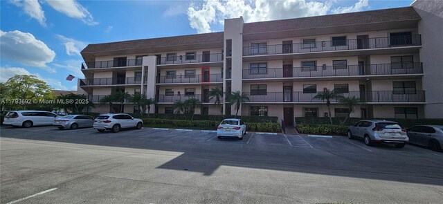10207 Sunrise Lakes Blvd Unit 307, Sunrise, FL 33322 - view of apartment building / complex featuring uncovered parking