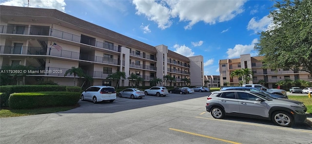 10207 Sunrise Lakes Blvd Unit 307, Sunrise, FL 33322 - view of apartment building / complex featuring uncovered parking