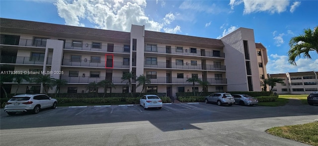 10207 Sunrise Lakes Blvd Unit 307, Sunrise, FL 33322 - view of apartment building / complex with uncovered parking