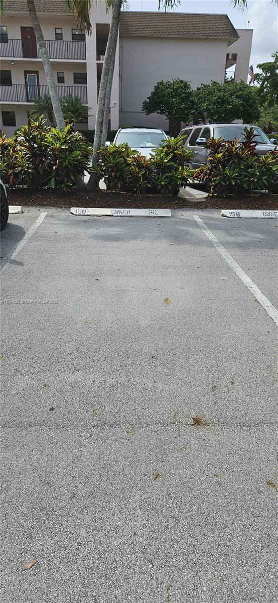 10207 Sunrise Lakes Blvd Unit 307, Sunrise, FL 33322 - view of uncovered parking lot