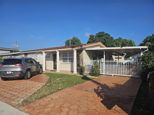 view of front of property featuring fence and stucco siding