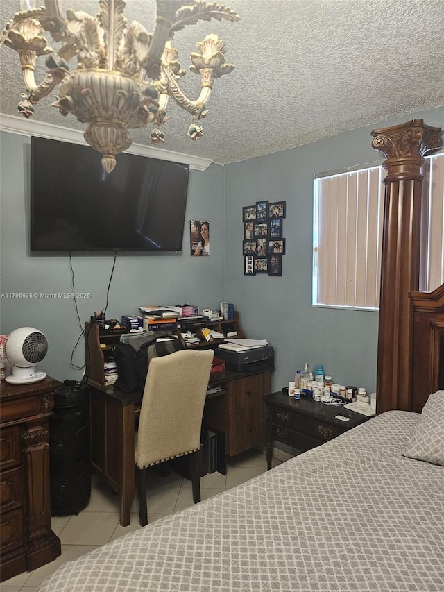 bedroom featuring light tile patterned flooring and a chandelier