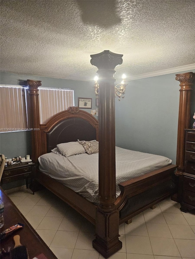 bedroom featuring crown molding, light tile patterned flooring, and a textured ceiling