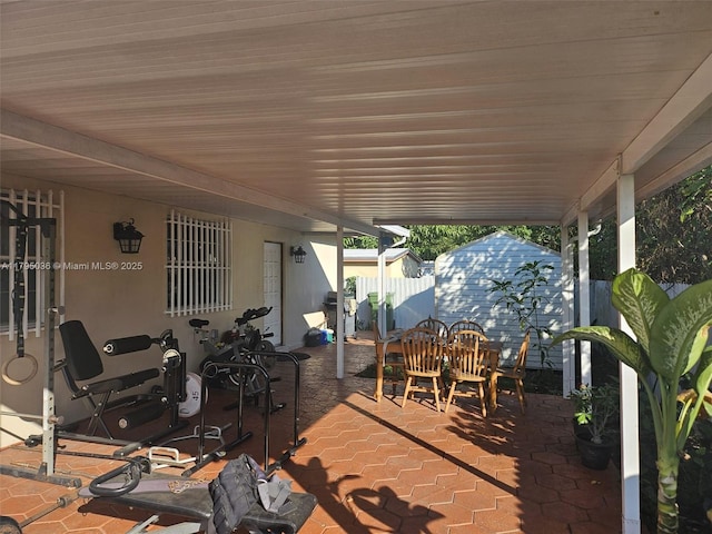 view of patio featuring fence