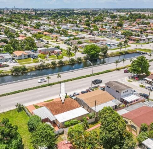 bird's eye view with a water view and a residential view