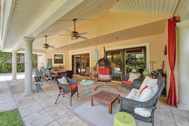 view of patio / terrace with ceiling fan and an outdoor living space