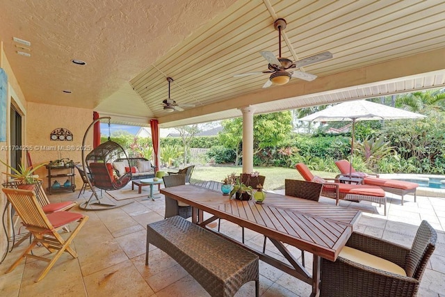 view of patio featuring fence, a ceiling fan, outdoor dining space, and outdoor lounge area