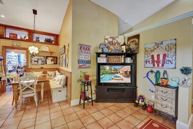 living area featuring an inviting chandelier, light tile patterned floors, and lofted ceiling