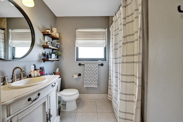 bathroom featuring toilet, tile patterned floors, a shower with curtain, and vanity