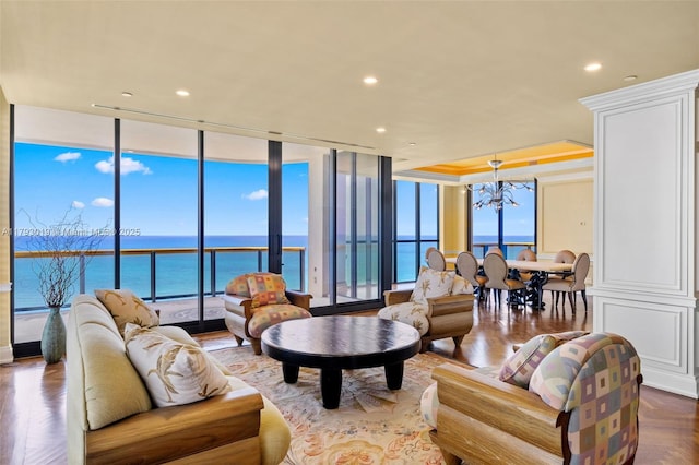 9999 Collins Ave Unit Ph3D, Bal Harbour, FL 33154 - living area featuring recessed lighting, a water view, a notable chandelier, and a wall of windows