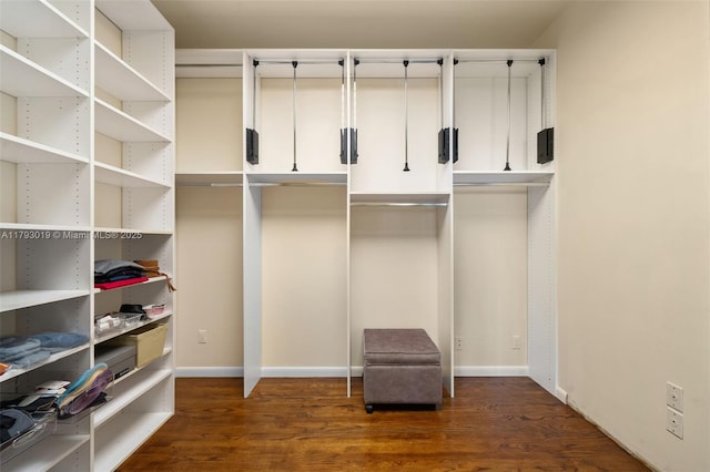 9999 Collins Ave Unit Ph3D, Bal Harbour, FL 33154 - walk in closet with dark wood-type flooring