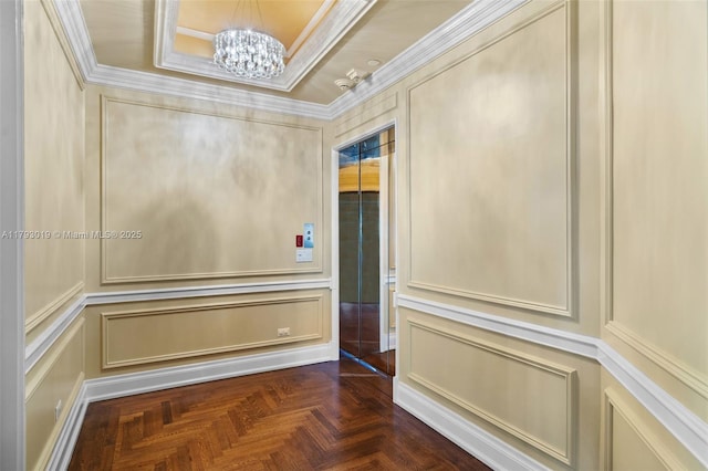 9999 Collins Ave Unit Ph3D, Bal Harbour, FL 33154 - corridor with crown molding, a tray ceiling, a notable chandelier, and a decorative wall