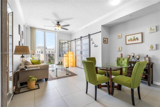 520 SE 5th Ave Unit 2713, Fort Lauderdale, FL 33301 - dining space with ceiling fan, ornamental molding, a textured ceiling, and a barn door
