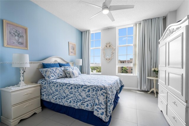 520 SE 5th Ave Unit 2713, Fort Lauderdale, FL 33301 - bedroom featuring ceiling fan, a textured ceiling, and light tile patterned floors