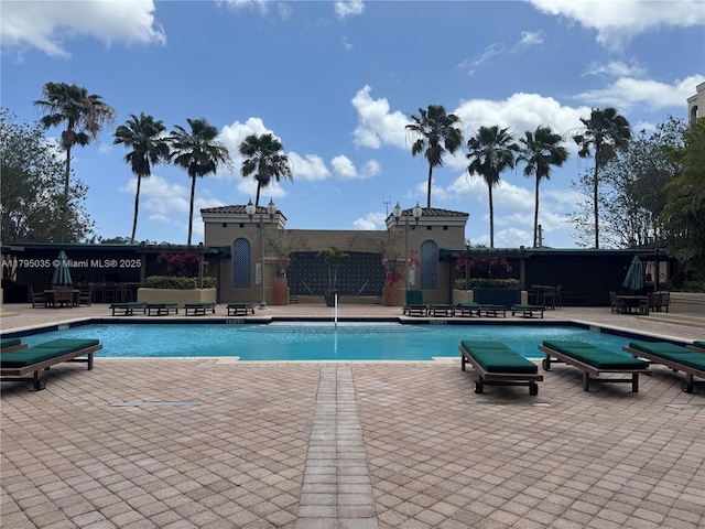 community pool with a patio