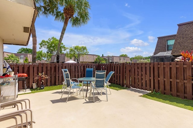 view of patio / terrace featuring outdoor dining space and a fenced backyard