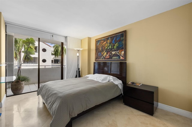 21075 NE 34th Ave Unit 306-2, Aventura, FL 33180 - bedroom featuring access to outside, baseboards, and tile patterned flooring
