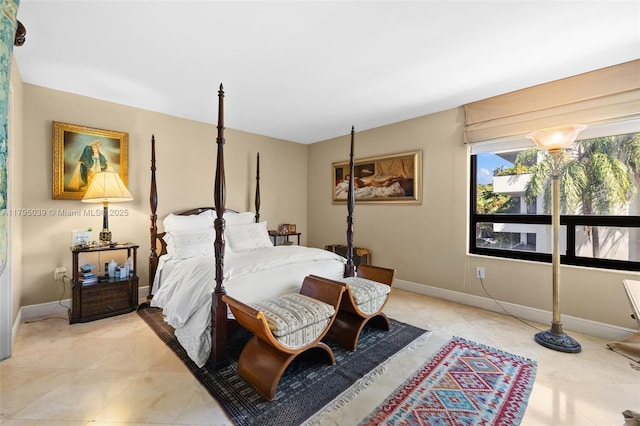 21075 NE 34th Ave Unit 306-2, Aventura, FL 33180 - bedroom with baseboards and light tile patterned floors