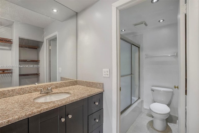 full bath featuring visible vents, vanity, combined bath / shower with glass door, toilet, and recessed lighting