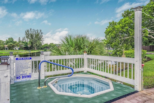 view of swimming pool featuring a community hot tub